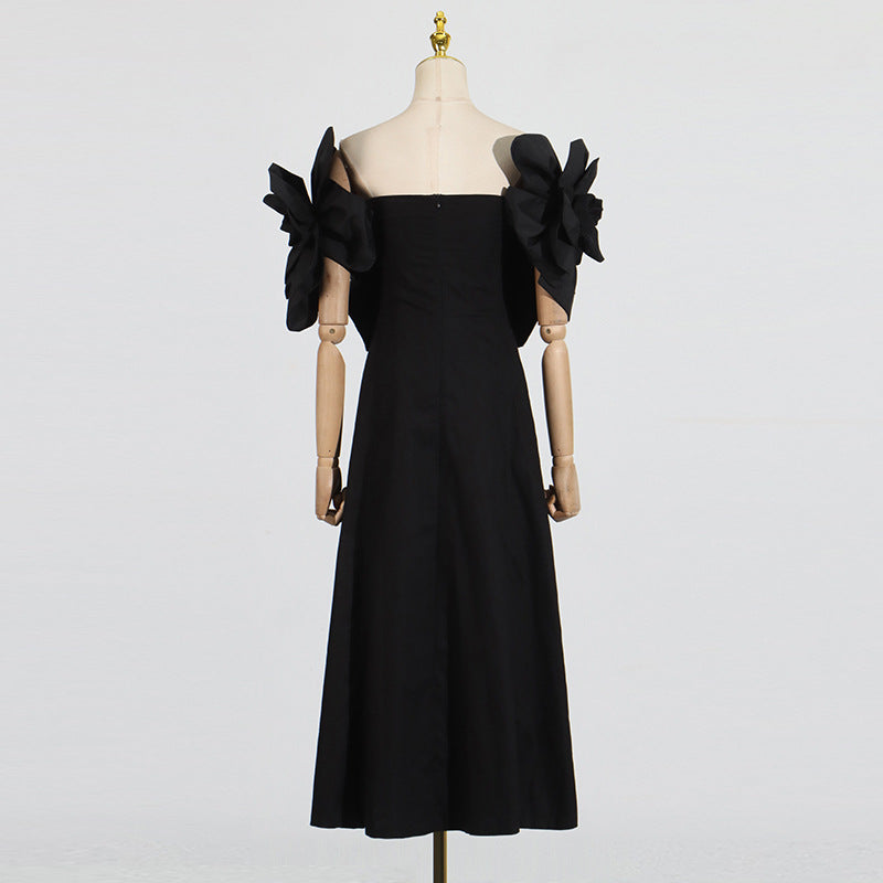This French-inspired maxi dress features a striking one-shoulder design with floral patchwork and a fitted waist. eprolo
