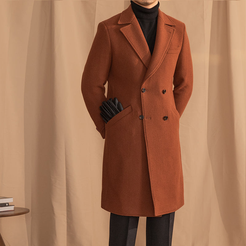 Brown overcoat worn by a person against a beige curtain background