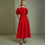 This French-inspired maxi dress features a striking one-shoulder design with floral patchwork and a fitted waist. eprolo
