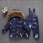 Premium white duck down jacket with detachable hood and 76-80% cashmere blend, designed for toddlers aged 1-3 years with soft-touch fabric and versatile solid or cartoon patterns. VELORIA - Thread of Generations