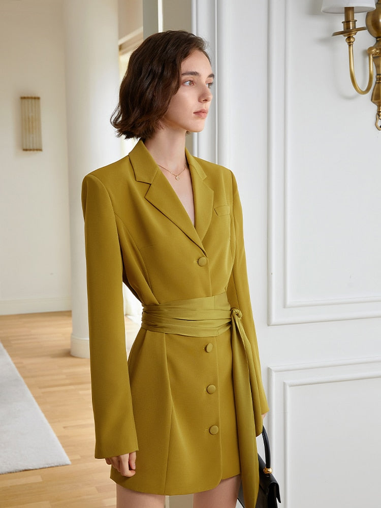 A striking yellow blazer dress with a cinched belt, lapel collar, and long sleeves. The loose fit offers comfort while the belt defines your shape. eprolo