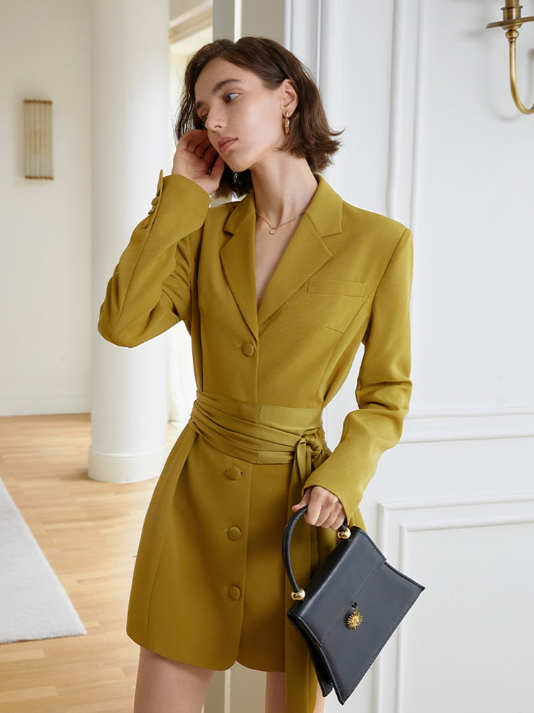 A striking yellow blazer dress with a cinched belt, lapel collar, and long sleeves. The loose fit offers comfort while the belt defines your shape. eprolo
