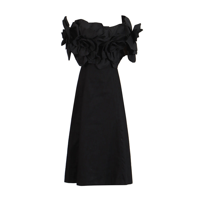 This French-inspired maxi dress features a striking one-shoulder design with floral patchwork and a fitted waist. eprolo