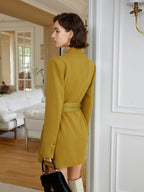 A striking yellow blazer dress with a cinched belt, lapel collar, and long sleeves. The loose fit offers comfort while the belt defines your shape. eprolo