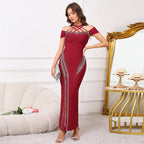 Elegant backless halter maxi dress with a fitted bodycon silhouette and beaded embellishments eprolo