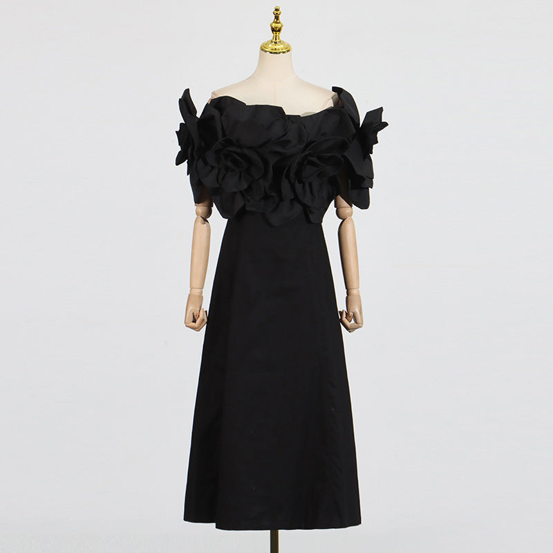 This French-inspired maxi dress features a striking one-shoulder design with floral patchwork and a fitted waist. eprolo