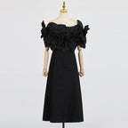 This French-inspired maxi dress features a striking one-shoulder design with floral patchwork and a fitted waist. eprolo