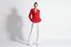 Red blazer on a mannequin against a white background