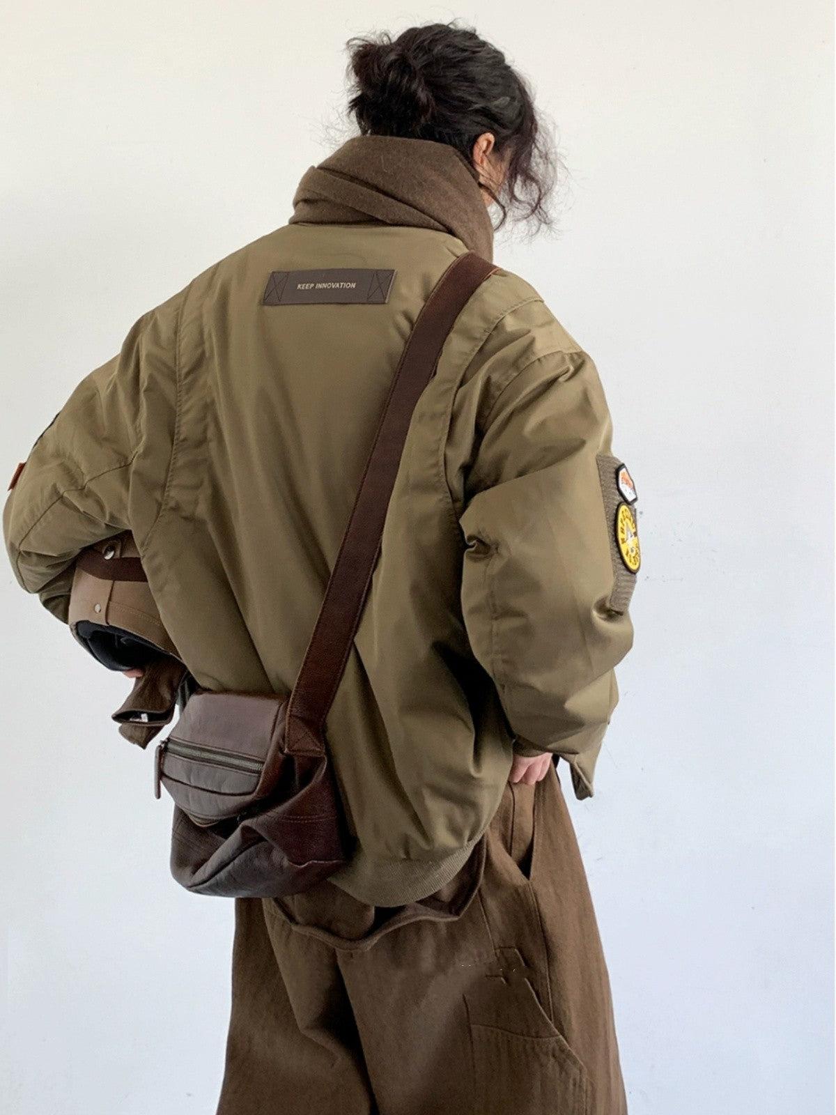 Embrace vintage-inspired style with this oversized pilot down jacket, designed for those who appreciate classic workwear aesthetics. LittleYogaSocks